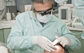 A dentist examining a patient's teeth